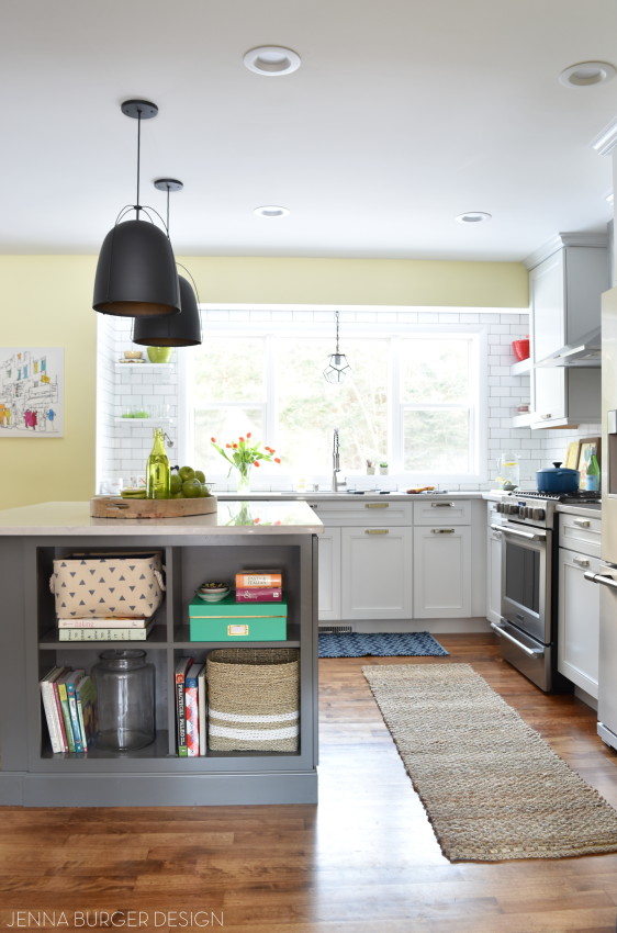 KITCHEN MAKEOVER REVEAL: before and after kitchen renovation with white & gray cabinets, open shelving, subway tile backsplash, quartz countertops, and layers of color. This kitchen is gorgeous! Check out the entire renovation process @ www.JennaBurger.com