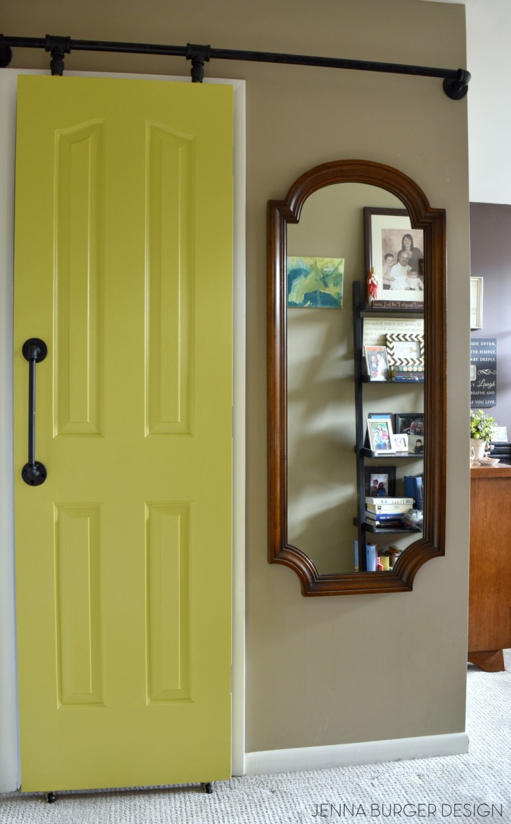 DIY: Rolling door hardware using plumbing pipe. Get the look + function of a rolling door for about $60. Custom size to fit your space. Tutorial by www.JennaBurger.com