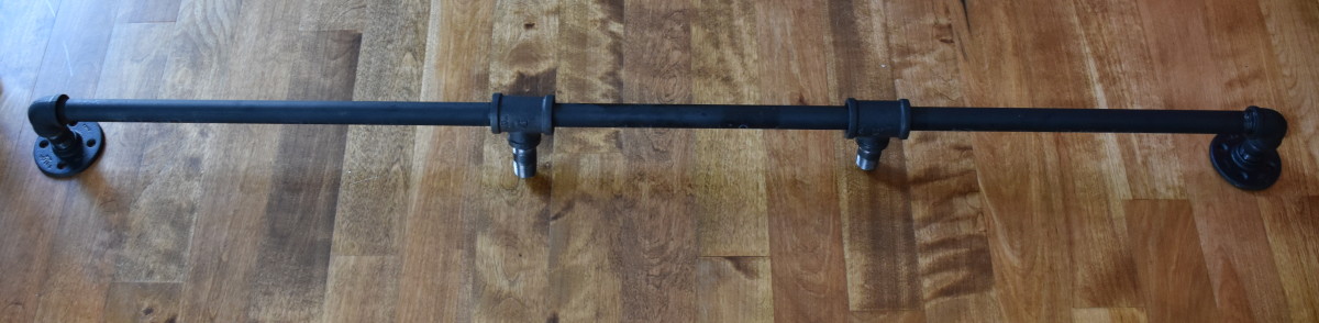 DIY: Rolling door hardware using plumbing pipe. Get the look + function of a rolling door for about $60. Custom size to fit your space. Tutorial by www.JennaBurger.com